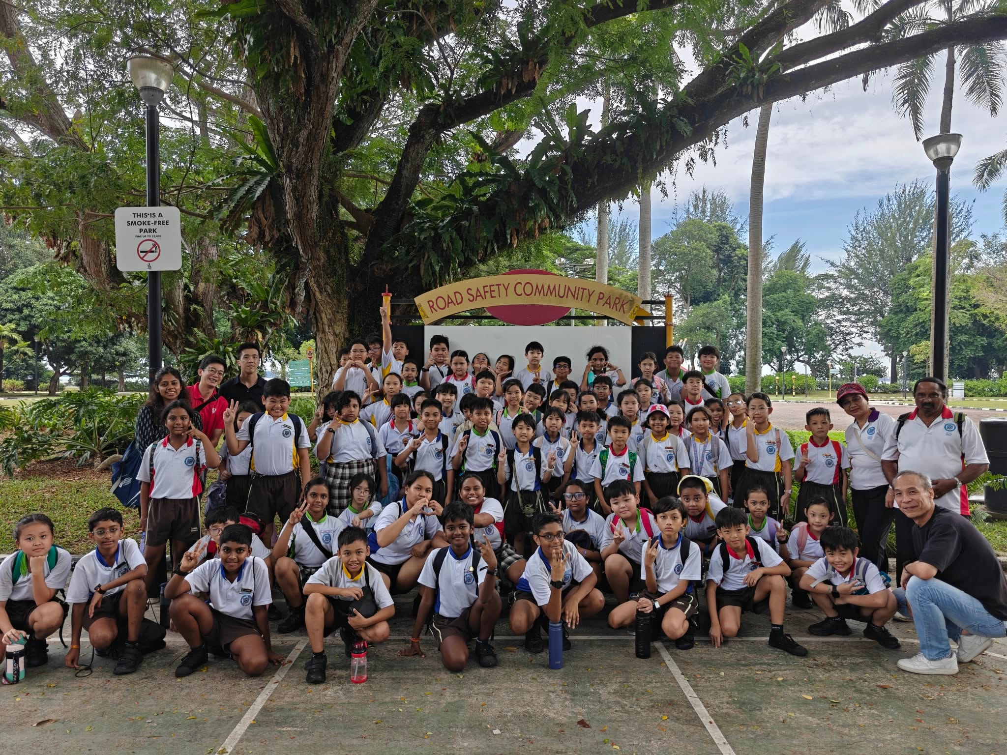 Students and staff gather for a group photo during the Road Safety Education Programme.